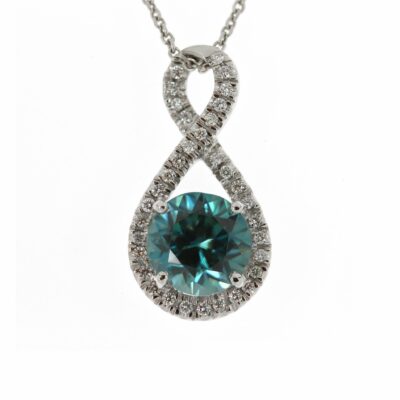 Figure of eight pendant with centre blue zircon