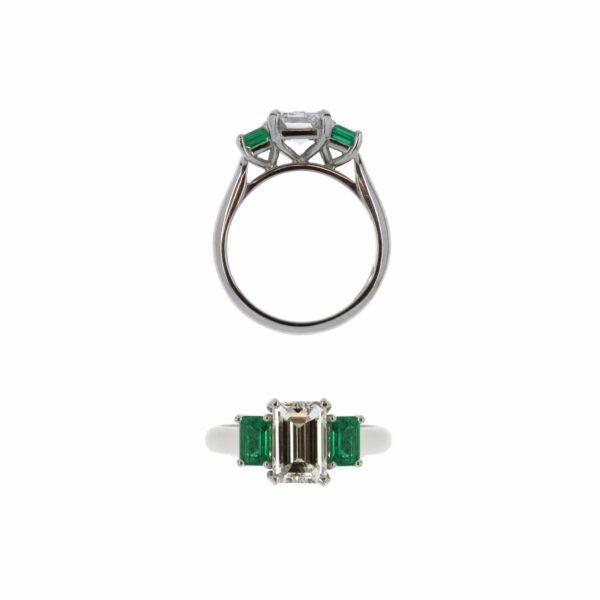 Platinum ring set with emerald cut centre diamond